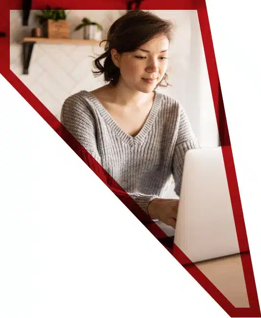 female freight forwarding student on laptop